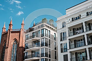 Modern architecture apartment buildings and old church - real estate in Berlin, Mitte