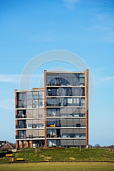Modern architecture apartment complex building with balconys with clear blue sky photo