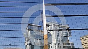 Modern architecture refletion in the glass facade photo