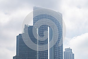 Modern architecture sky scrapers on a foggy day