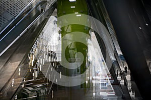 Modern architecture Tube DLR station with escalators, Multiple exposure image. London, UK