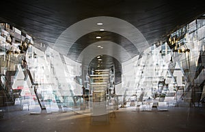 Modern architecture Tube DLR station with escalators, Multiple exposure image. London, UK