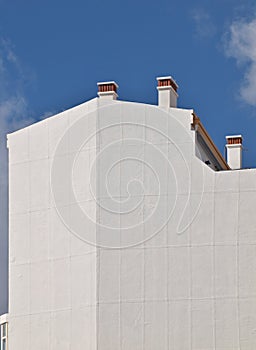 Modern architecture in white in front of blue sky