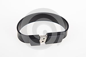 Modern armlet key USB Flash drive black like bracelet on white background