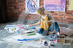 Modern art school female artist painting artworks