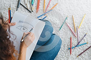 Modern art school student sketching pencils