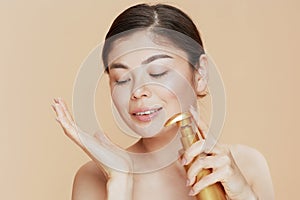 modern asian woman with bottle with spa cream