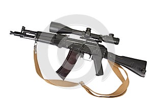 Modern assault rifle with telescopic sight on white