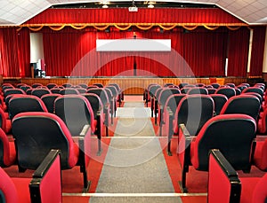 Modern Auditorium with Red Curtains