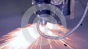 Modern automated laser metall cutter. Contemporary heavy industrial equipment making high precision steel parts.