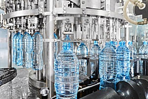 Modern automated mineral water bottling line at the plant