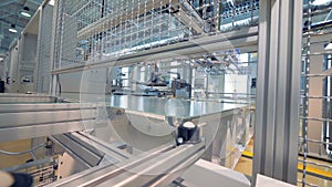 Modern automated production concept - factory producing solar panels.