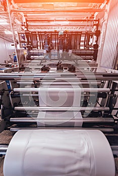 Modern automated production line in factory. Plastic bag manufacturing process