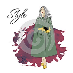 A modern autumn look. Fashion and Style. Beautiful stylish girl or woman in a coat