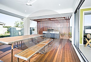 A modern backyard kitchen with outside grill