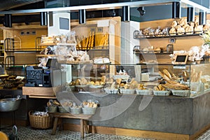 Modern bakery with different kinds of bread and buns