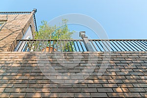 Modern balcony and blue sky with natural green tree gardening exterior for home and living achitecture decoration. Vintage house c