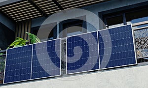 Modern balcony power plant on a railing, alternative power generation