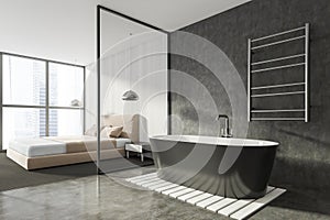 Modern Bathroom bedroom interior in new luxury home. Stylish hotel room. Open space area. Wooden walls concrete floor. Black