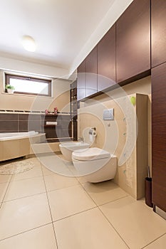 Modern bathroom with beige tiles