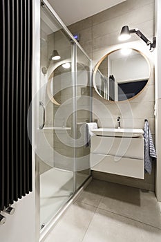 Modern bathroom with beige tiles