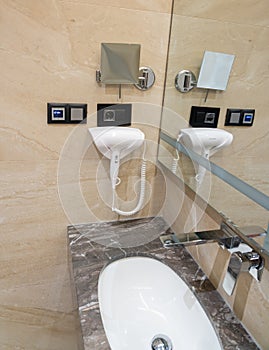 Modern bathroom equipment with hairdryer and remote control
