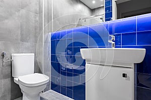 Modern bathroom with glossy tiles
