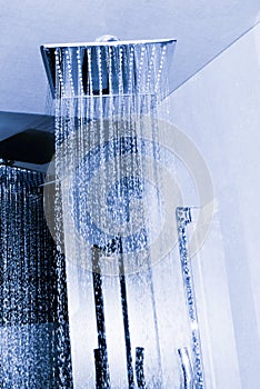 Modern bathroom interior with ceiling shower