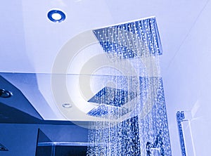 Modern bathroom interior with ceiling shower