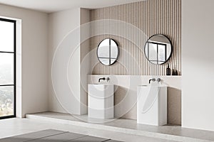Modern bathroom interior with dual sinks, round mirrors, and a view through the window, on a light background, concept of a