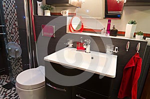 Modern bathroom interior with red accents