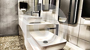 Modern bathroom interior with sink and mirror. Modern Bathroom Interior With Marble Sink and Wall Mirror