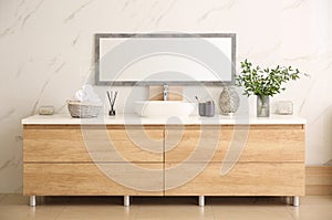 Modern bathroom interior with stylish mirror and vessel sink