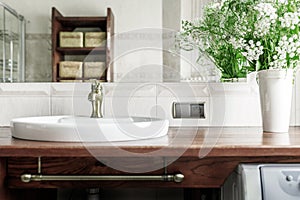 Modern bathroom interior with stylish mirror and vessel sink