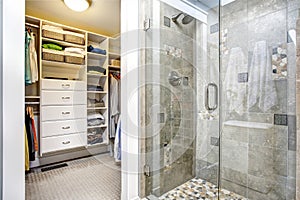 Modern bathroom interior with walk-in closet