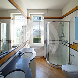 Modern bathroom with large mirror