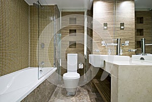 Modern bathroom with marble floor and mosaic tiles