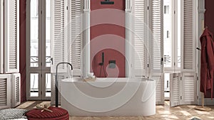 Modern bathroom in red tones in classic apartment with window with shutters and parquet. Freestanding bathtub, pouf with