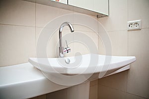 Modern bathroom sink in white ceramic