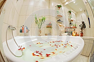 Modern bathroom in warm tones with jacuzzi