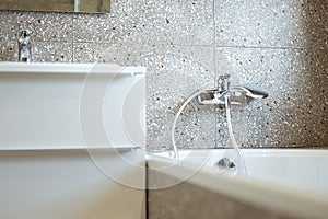 Modern bathroom water mixer close-up