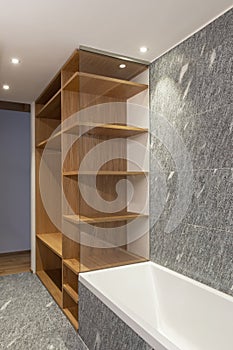 Modern bathroom with wood and stone, minimalist. Nobody inside