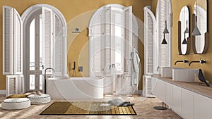 Modern bathroom in yellow tones in classic apartment with arched window. Freestanding bathtub, washbasins, mirrors, carpet, rack