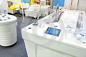 Modern bathtubs and jacuzzi in store