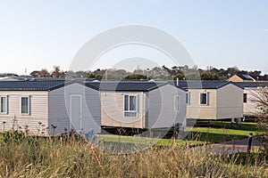 Modern beach holiday homes. A row of seaside vacation lodges