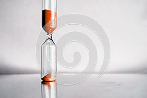 Modern beautiful hourglass with bright background for copy space. Hourglass time passing concept for business deadline