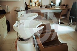 modern beauty salon with chairs and salon backwash unit photo