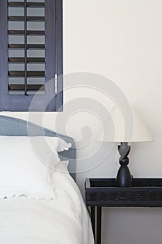 Modern bed with table lamp