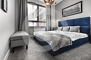 Modern bedroom with blue bed