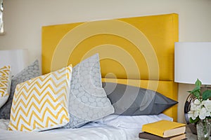 Modern bedroom detail yellow and white